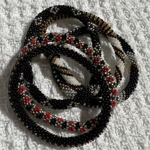 5 Sashka Co handcrafted beaded bracelets. Black white red silver. Approx 8”.